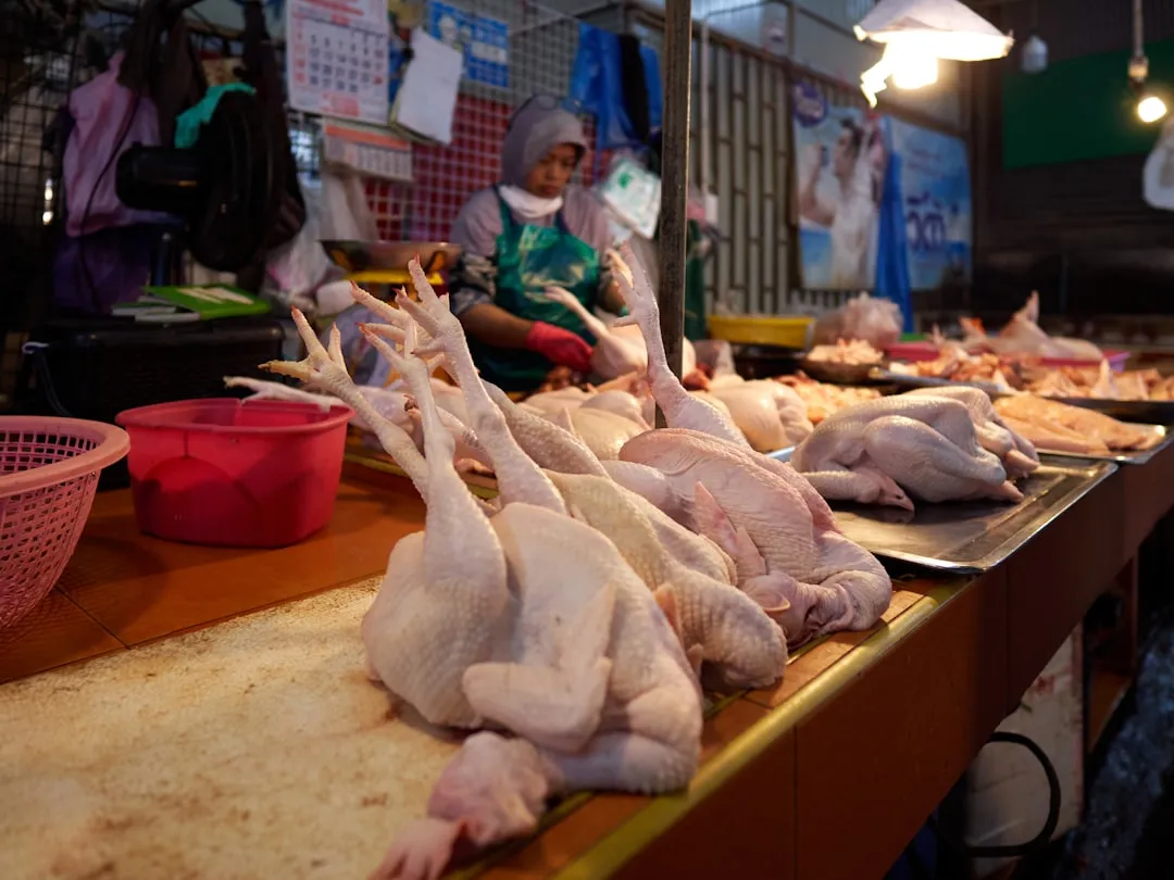 Photo cleaning and portioning a whole chicken